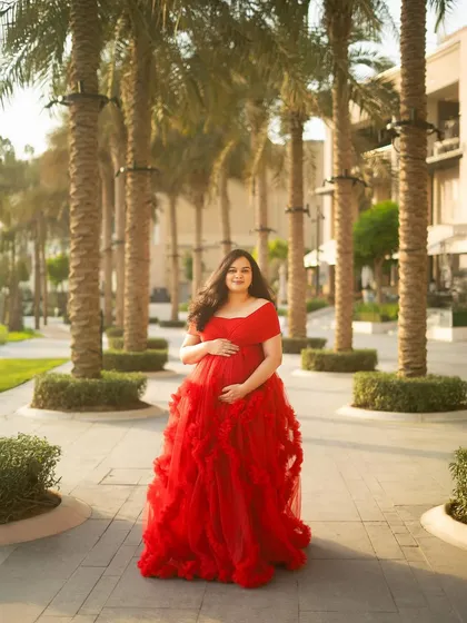 This is the moment that captures it all. The vibrant red gown against the beautiful Dubai palms during the golden hour is pure magic. I love creating these breathtaking portraits that feel like they are straight out of a fairytale.