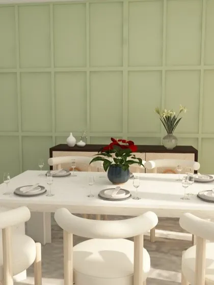 The dining area of this design features a fresh green wall cladding and light-colored furniture, creating an airy and Scandi-inspired feel.