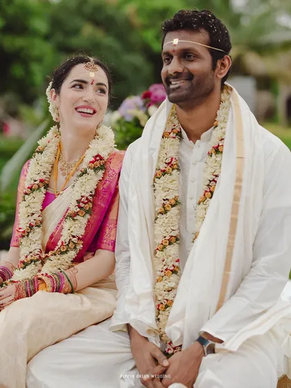 Elisabetta and Suman sharing a smile during their Hindu wedding ceremony. This image beautifully captures the blending of two cultures in a celebration of love.