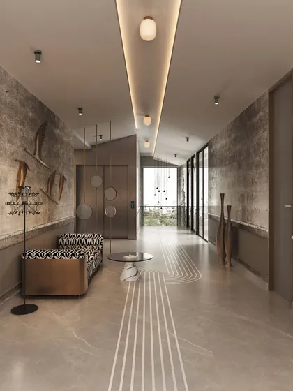 This hallway in our Ludhiana Villa project showcases quiet opulence. We used textured walls, intricate floor patterns, and sculptural art pieces to transform a transitional space into a designed experience, with gold details adding a touch of drama.