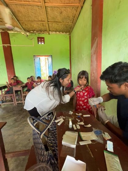 Serving a purpose, one person at a time. Here I am assisting with health screenings in a village. This work is a core part of who I am.