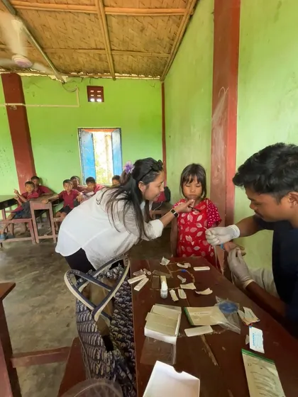 Serving a purpose, one person at a time. Here I am assisting with health screenings in a village. This work is a core part of who I am.