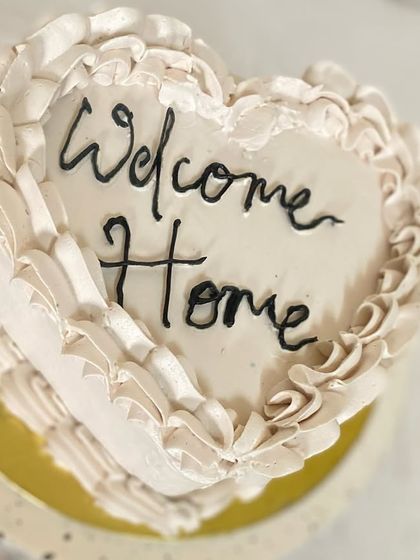 A closer look at the delicate ruffle piping on our "Welcome Home" heart cake.