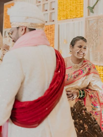 Candid laughter among the family members during the wedding ceremony. We focus on capturing the reactions of guests as well as the couple.
