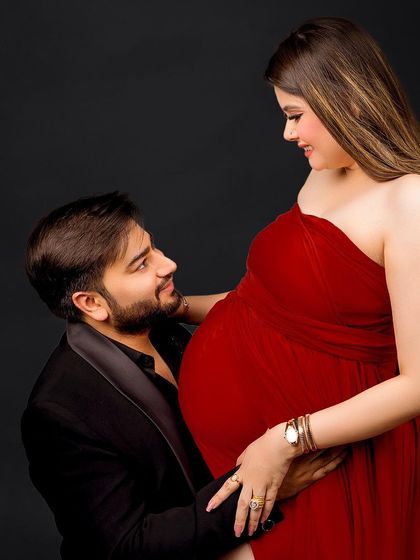 A close-up filled with anticipation and love. This angle beautifully highlights the connection between the couple and the baby bump.