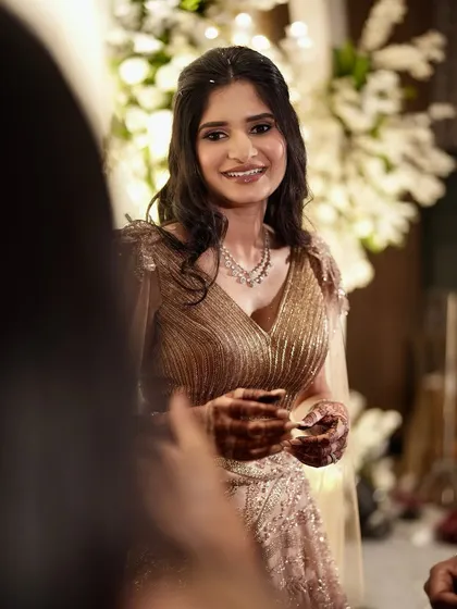 Another shot capturing the joy of the moment. Her makeup looks fresh and luminous, even in a candid shot.
