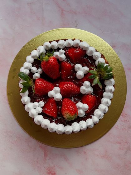 You can't go wrong with a classic strawberry cake. This beauty is topped with a generous amount of fresh strawberries and whipped cream, a perfect treat while the season lasts.