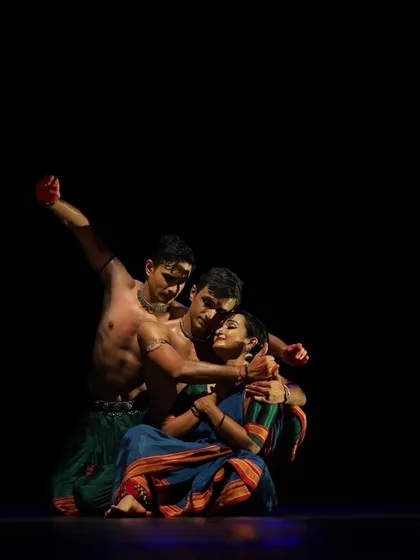 An intimate trio pose from 'Nagamandala'. Crafting these moments of connection is key to telling a compelling story through group choreography.