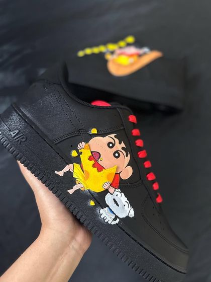 A minimal but bold Shin-chan custom on a pair of all black Air Force 1s. The bright colors of Shin-chan and his dog Shiro really pop against the black leather. Sometimes, less is more.