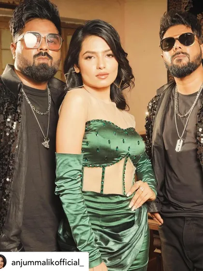 A behind-the-scenes look from the song 'Koka'. I designed this glamorous party look featuring a custom emerald green satin dress with a sheer corset bodice and matching gloves for a bold, high-fashion statement.
