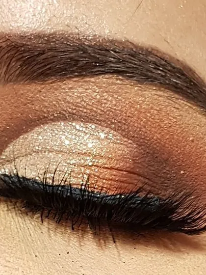 Here is my attempt at a half cut crease on myself. This technique creates a sharp, defined crease on the outer half of the eye, making it a great style for hooded eyes. I used warm bronze and gold tones for this look.