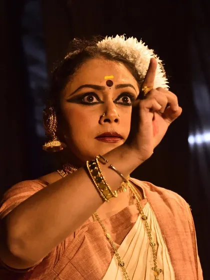 The essence of Mohiniyattam lies in its 'abhinaya' or expression. This is a close-up from a solo recital at Sreeramaswami temple, where every glance and gesture tells a story, allowing the dance to shine through the dancer.