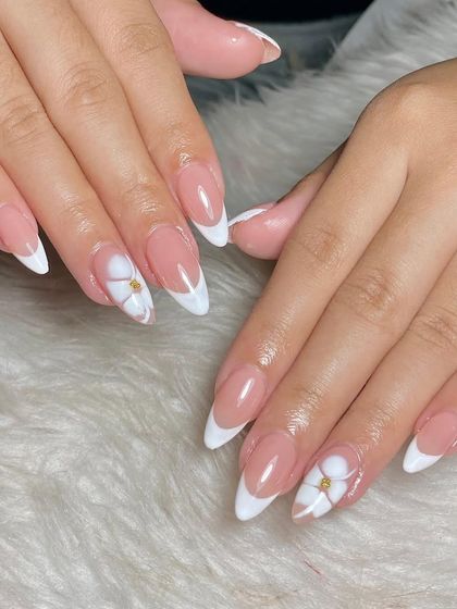 Classic almond-shaped French tips with a delicate touch. I added a simple 3D white flower with a gold stud at the center for a hint of floral elegance.