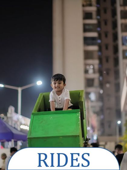 A happy toddler enjoying a gentle ride at an evening event. I offer a range of rides suitable for different age groups, ensuring even the youngest guests have a wonderful time.