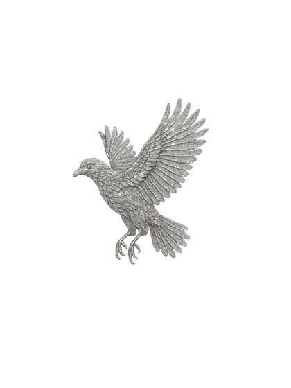 An isolated view of the hand-embellished bird motif. Each sequin is carefully placed to create a soaring silhouette, a symbol of freedom and elegance.