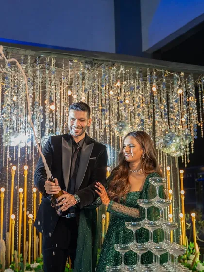 A classic champagne tower moment to kick off the celebrations. I set this up against a glittering backdrop of disco balls and warm lights, adding a touch of Hollywood glamour to the cocktail night.