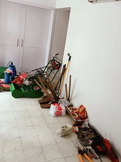 Our complete set of professional gardening tools, including lawnmowers, shears, and spades, all prepared for the annual Vishwakarma pooja. We invest in quality equipment to deliver quality work.