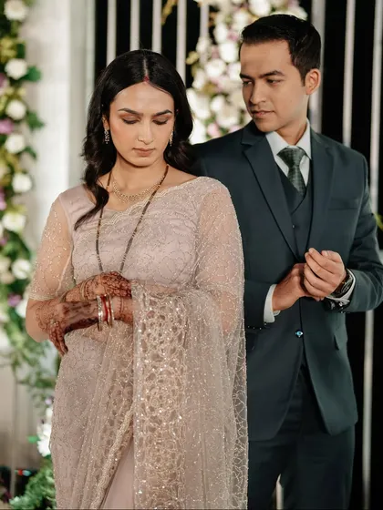 A quiet, candid moment between the newlyweds at their reception. It's these unposed shots that often hold the most emotion.