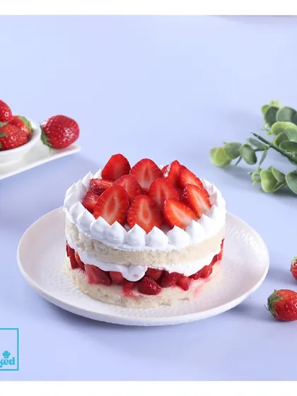 A simple yet perfect Strawberry Vanilla cake. This dessert highlights the freshness of the strawberries against a light vanilla sponge and cream, making it an ideal seasonal treat.