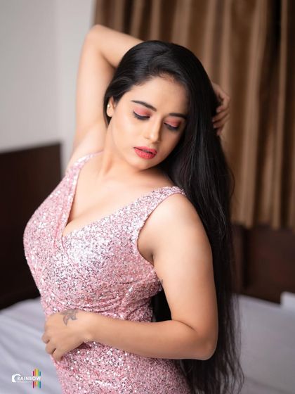 Another pose from the pink sequin dress shoot, capturing a thoughtful and glamorous look.