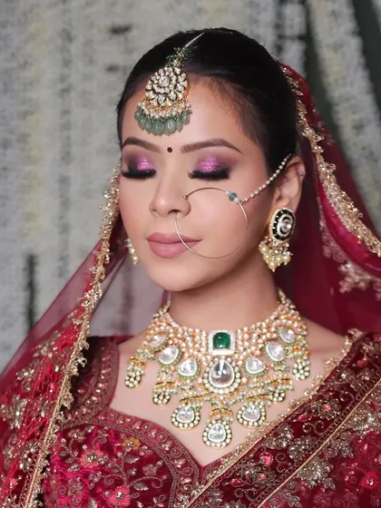 This holographic eye makeup is for the bride who wants to make a statement. The multi-tonal shimmer catches the light beautifully, creating a mesmerizing effect that is both modern and perfect for a grand bridal entrance.