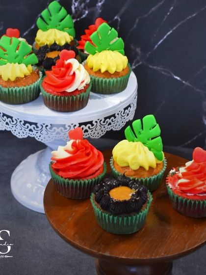 A colorful assortment of cupcakes baked and decorated by my masterclass students. We explored different flavors like red velvet and pineapple, and topped them with fun, tropical decorations.