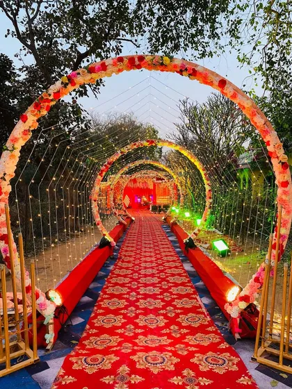 A still shot of the circular floral arch entrance, perfect for making a grand statement at any outdoor wedding.