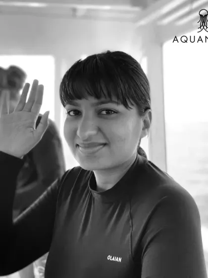 A friendly wave from one of our community members on a dive trip. The bonds formed on these trips last a lifetime.