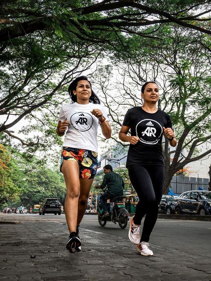 Running side-by-side with a teammate. In our community, we pace each other, motivate each other, and make sure no one gets left behind.