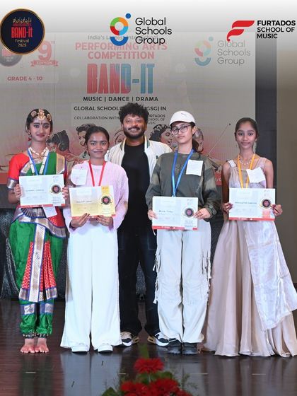 A group of winners from various categories at the Bangalore Band-It competition pose together. This photo showcases the breadth of talent, from classical dance to contemporary performance, that we nurture.