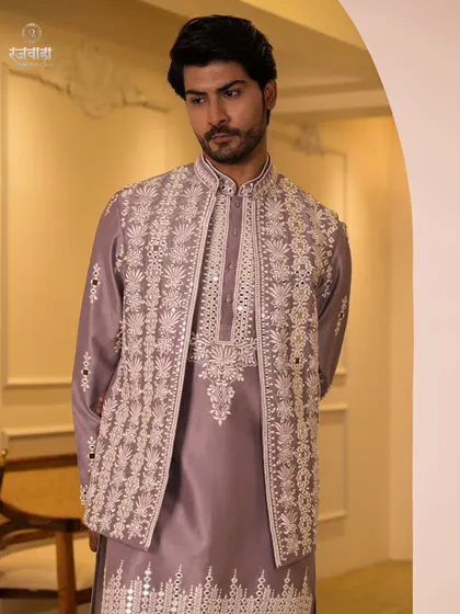 A formal, straight-on view of the lilac Indo-Western outfit. The symmetry of the embroidery and the clean cut of the jacket are highlighted in this shot.