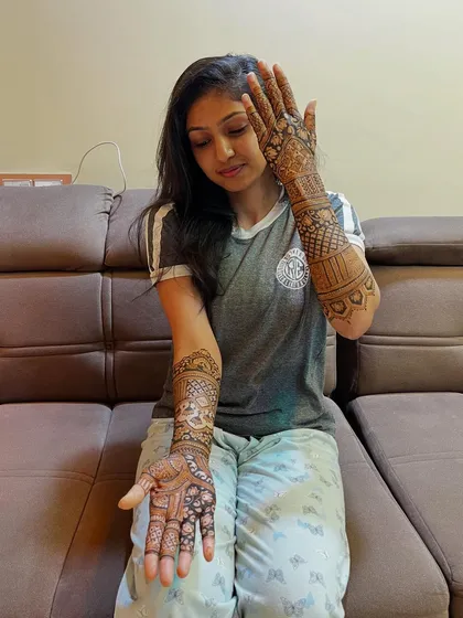A different angle, showing the design on one palm and the back of the other hand. The patterns are beautifully balanced.