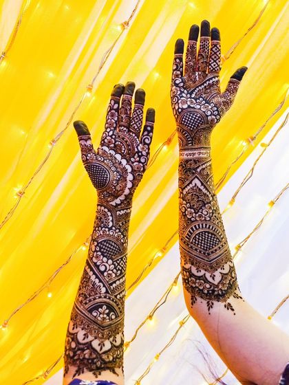 A stunning, full-coverage bridal design against a bright yellow backdrop.