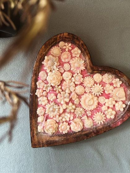 A close-up view of the floral details on my heart-shaped dough bowl candle. I enjoy making each tiny flower and arranging them to create this stunning, textured look.