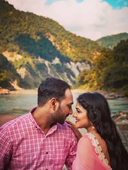 Another beautiful close-up from a Rishikesh pre-wedding shoot, focusing on the couple's expressions against the mountain scenery.