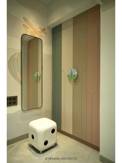 The wardrobe in this daughter's room features a playful, multi-colored design with unique, fun handles. We believe that storage can and should be a joyful part of a kid's room design.