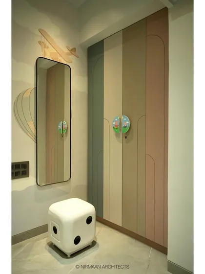 The wardrobe in this daughter's room features a playful, multi-colored design with unique, fun handles. We believe that storage can and should be a joyful part of a kid's room design.