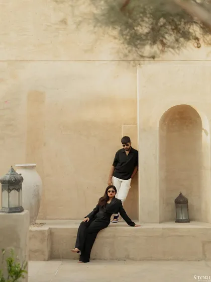 A pre-wedding shoot in Dubai, using the stunning architecture of Al Seef to create a modern, high-fashion portrait. This shows how we can blend your personal style with the character of a location for a truly unique concept.