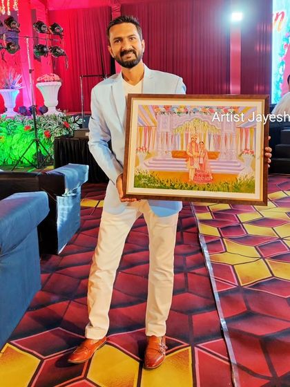 Holding the completed live wedding painting. It was a challenging but rewarding experience to create this piece live during a grand wedding event.