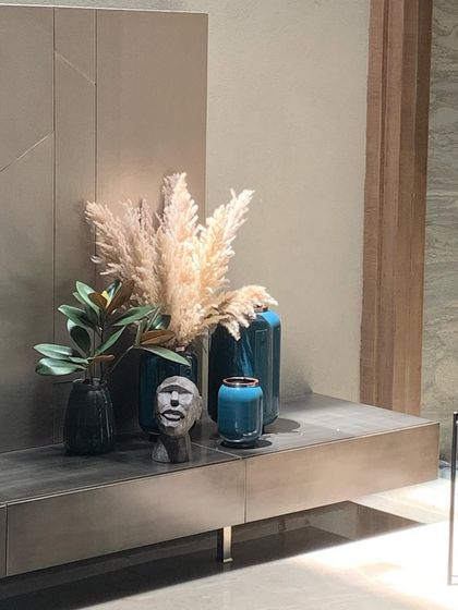 A curated collection of vases and a small sculpture sit on a console, showing how I use accessories to complete the story of a space.