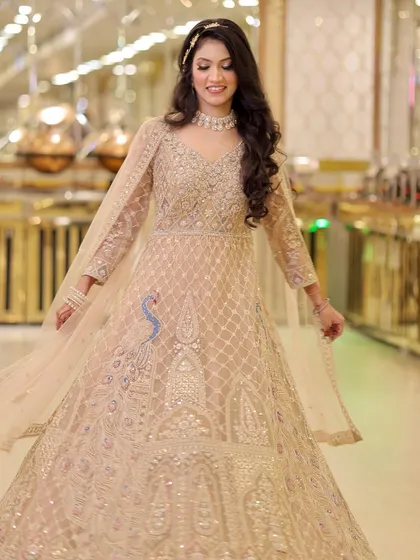 Another beautiful twirl, showcasing the peacock embroidery on her gown and the flowing silhouette.