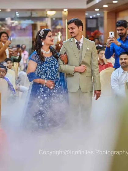 The couple makes a grand entrance through a cloud of low-lying fog. I use special effects like this to add a cinematic and dreamy quality to your event photos.