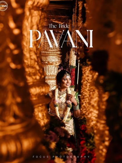 A beautifully captured moment of the bride. The warm lighting highlights the golden tones in her saree and jewelry, and the makeup is designed to look stunning in such professional shots.