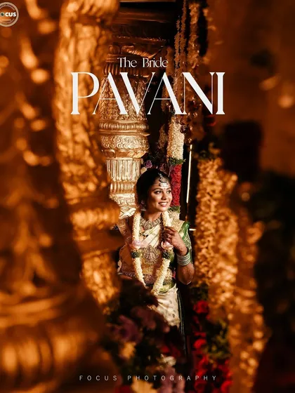A beautifully captured moment of the bride. The warm lighting highlights the golden tones in her saree and jewelry, and the makeup is designed to look stunning in such professional shots.