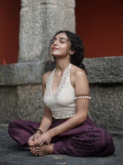 Seated in a simple meditative pose, I connect with the feeling of being rooted in self-love. This inner foundation allows my spirit and energy to soar.