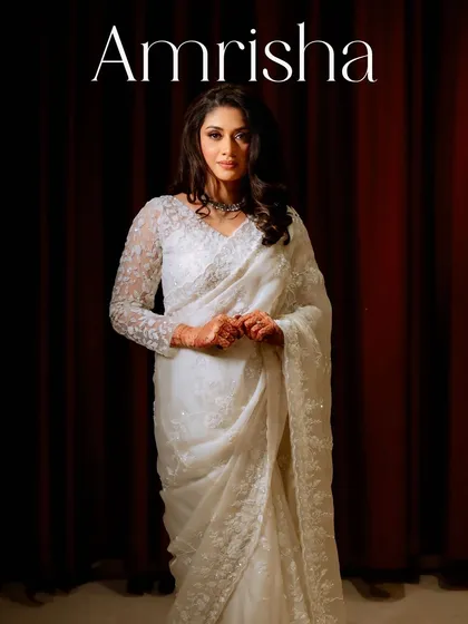 A classic portrait of Amrisha. Her reception look is one of delicate sophistication and radiant glow.