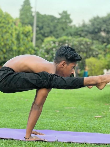 This arm balance, Tittibhasana or Firefly Pose, requires immense core and arm strength. Never underestimate your own power.