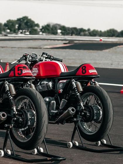 Two Royal Enfield GT 650s on paddock stands, ready for the track.