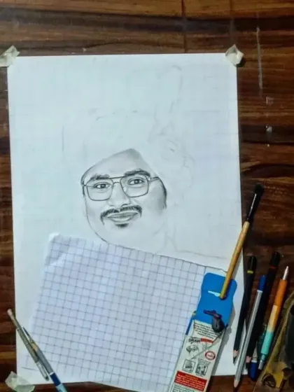 An earlier stage of the same sketch, showing how I protect the finished areas with paper to avoid smudging.