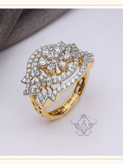 A magnificent diamond statement ring with a floral or peacock-inspired design. The intricate setting of numerous small diamonds creates a dazzling effect, making this a centerpiece of any fine jewellery collection.